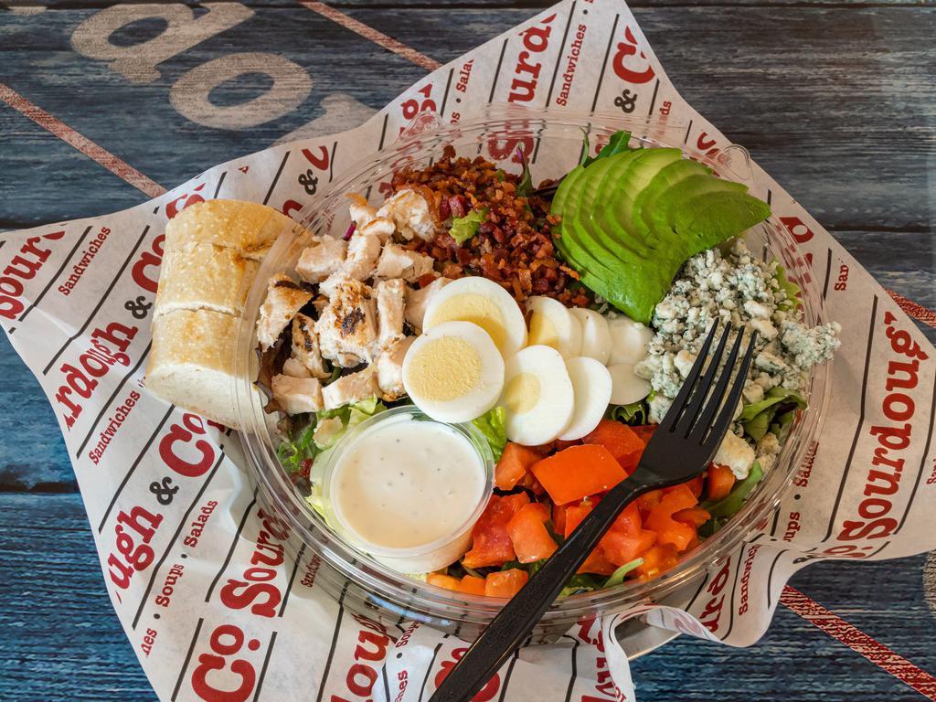 Cobb Salad · Chopped romaine and spring mix, cherry tomatoes, crisp bacon, sliced hard-boiled egg, avocado, grilled chicken, crumbled Gorgonzola and blue cheese dressing.