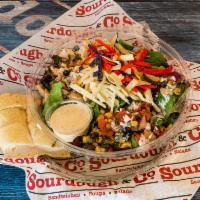 Southwest Chicken Salad · Baby greens and chopped romaine, grilled chicken, sliced avocado, black bean corn salsa, sou...