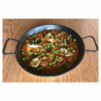 Chicken Paella · Valencia style rice, chicken, artichoke hearts, cremini mushrooms, green peas, red sofrito, ...