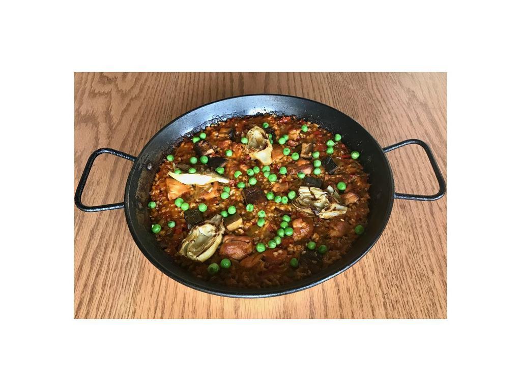 Chicken Paella · Valencia style rice, chicken, artichoke hearts, cremini mushrooms, green peas, red sofrito, saffron