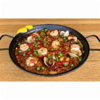 Paella Mixta · Valencia style rice, calamari, clams, shrimp, chorizo, chicken, sofrito, saffron