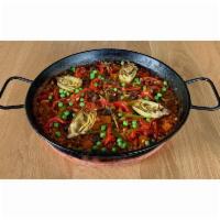 Paella Vegetales · Valencia style rice, Portobello mushrooms, asparagus, carrots, artichoke confit, green peas,...