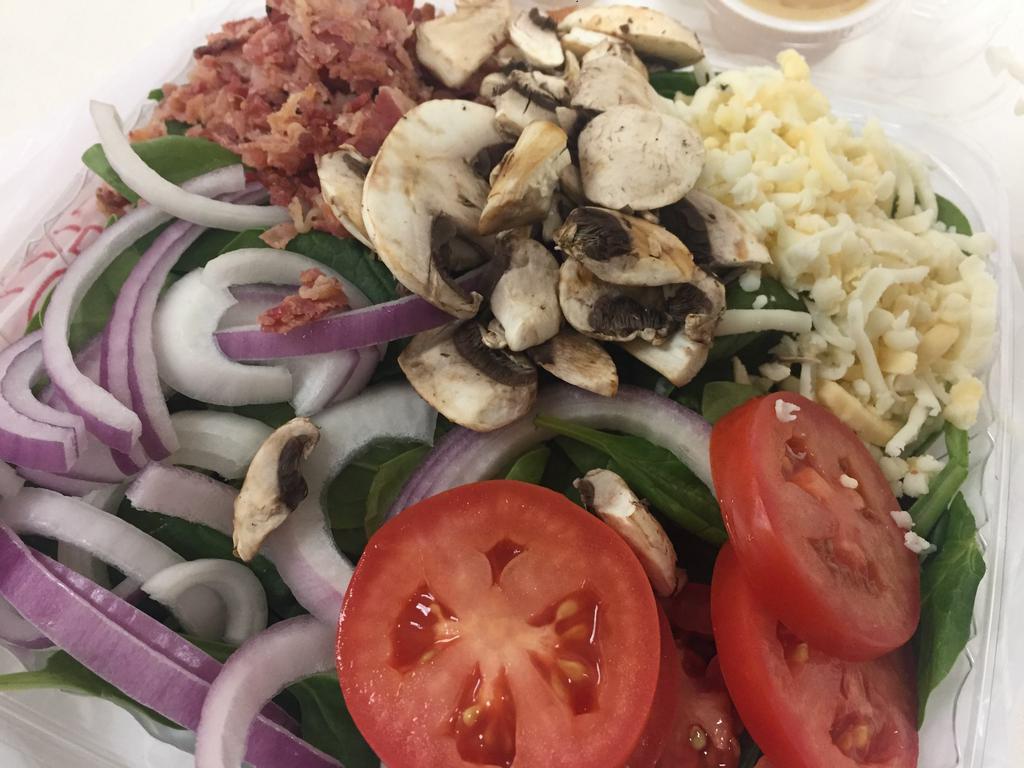 Spinach Salad · Spinach, bacon, onions, mushrooms, tomatoes and cheese.