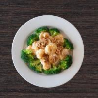 Walnut Shrimp · Lightly battered shrimp covered with a honey glazed sauce, garnished with broccoli, topped w...