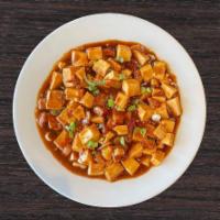 *NEW* Mapo Tofu · Soft tofu cooked with BBQ pork in a garlic chili sauce topped with green onions. Spicy.
