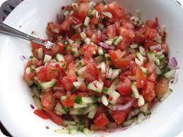 Kachumber Salad · Fresh chopped tomato, cucumbers, onions and chili pepper.