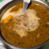 Daal Makhani · Black lentils cooked overnight on a slow fire with herbs and butter.