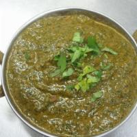 Saag Gosht · Lamb cooked with spinach and spices. Served with rice.