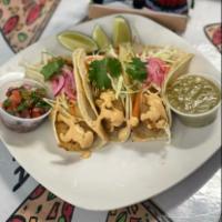 Shrimp Tacos · Three shrimp tacos served with red pickles, onions, coleslaw, chipotle cream, pico de gallo,...