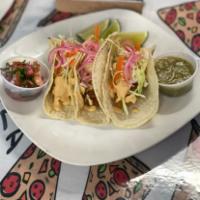 Fish Tacos · Three fish tacos served with red pickles, onions, coleslaw, chipotle cream, pico de gallo, a...
