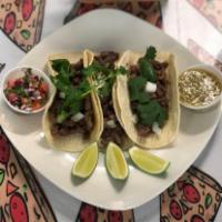 Steak Tacos · Three New York Strip Steak Tacos come with cilantro, onions, pico de gallo and green salsa. 
