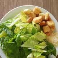 Caeser Salad · Romaine lettuce, tomatoes, onions, parmesan cheese, croutons and caesar dressing.