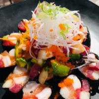 A Corner Yummy Maki · Tuna, salmon, escolar, krab, masago, wrapped with seaweed nori, topped with spicy fish salad...