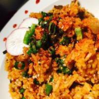 Kimchi Fried Rice · Stir fried rice with kimchi, gachujang hot pepper paste, eggs, tofu, sesame seeds and scalli...