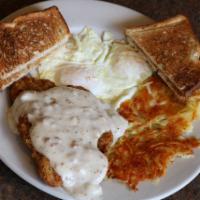 Country Fried Steak and Eggs · Country fried steak in sausage gravy and 2 eggs any style. Served with hash browns and choic...