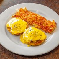 Eggs Benedict · Poached eggs on English muffin with Canadian bacon and hollandaise sauce. Served with hash b...