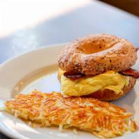 Bagel Sandwich · Ham, bacon, or sausage, eggs, cheese, and with hash browns.