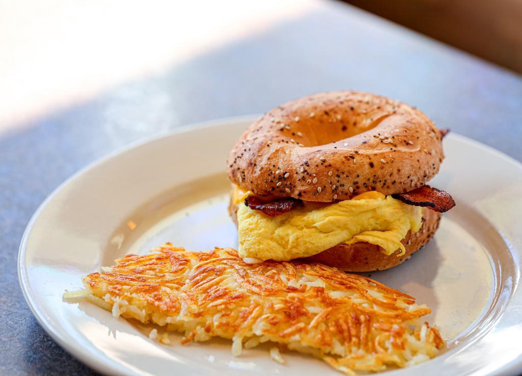 Bagel Sandwich · Ham, bacon, or sausage, eggs, cheese, and with hash browns.