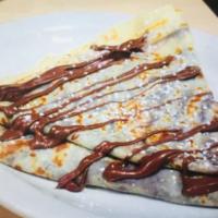 Crepe Chocolate D’amour · Fresh strawberries, Nutella, chocolate sauce and vanilla ice cream. Served with whipped crea...