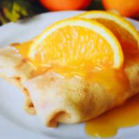 Crepe Suzette · Fresh sliced oranges, orange sauce and grand marnier. Served with whipped cream and powdered...