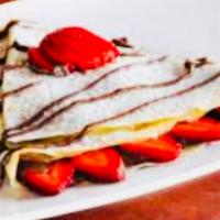 Crepe a la fraise · Fresh strawberries and blueberries, homemade berry sauce, and vanilla ice cream. Served with...