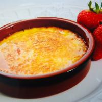 Homemade Creme Brulee · Served with caramelized brown sugar.