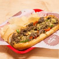 South Philly Cheesesteak · Beef or chicken, grilled onions, mushrooms, bell peppers and housemade cheese whiz on top.
