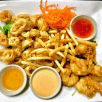 Crispy Shrimp and Calamari Platter · Crispy tempura shrimp and calamari served with fries and Sriracha aioli