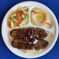 #2. Kafta Kabab Plate · Grilled seasoned lean ground beef and lamb served over rice, with hummus and garden salad.