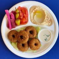 #8. Falafel Plate · Fried falafel patties served with hummus, lettuce, tomatoes, turnip pickles and tahini sauce.