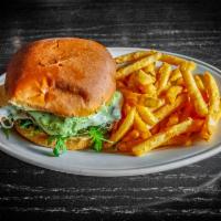 Chicken Cutlet Sandwich · crispy chicken cutlet, arugula, tomato, provolone cheese, and basil mayo, served on a brioch...