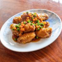 Mandarin Chicken Wings · Hot and spicy. Crispy chicken wings, carrots & peas, in spicy mandarin sauce. (10pc)