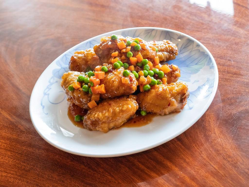 Mandarin Chicken Wings · Hot and spicy. Crispy chicken wings, carrots & peas, in spicy mandarin sauce. (10pc)