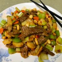 Kung Pao Beef · Hot and spicy. Beef, celery, water chestnuts, and peanuts in chili sauce.