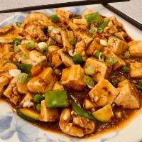 Ma Po Tofu Without Meat · Hot and spicy. Soft tofu, peas, carrot, and mushroom in spicy brown sauce. Vegan.