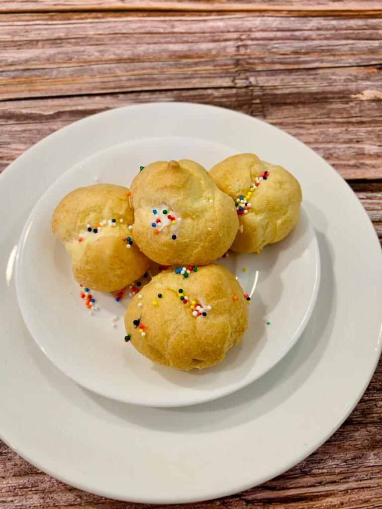 Mini Cream Puffs (4PC) · Filled with fresh vanilla flavored whipped cream.