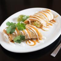 Burrito · A flour tortilla filled with choice of meat, cheese, beans, rice, lettuce and sour cream.