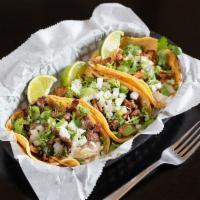 Taco · 1 soft corn tortilla filled with choice of meat topped with onions and cilantro.