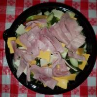 Chef Salad · Blend of lettuce, cucumber, tomato, slices of ham, American and Swiss cheese and green pepper.