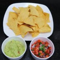 Chips with Fresh Guacamole · Fresh guacamole and homemade tortilla chips.