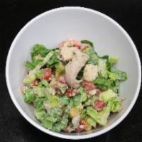 Caesar Salad · Pulled rotisserie chicken, bacon, romaine lettuce, diced tomatoes, croutons, Caesar dressing.