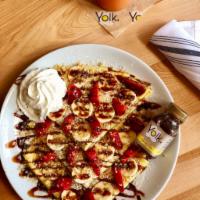 Nutella Crepes · Stuffed with Nutella, topped with bananas, strawberries, chopped walnuts, chocolate sauce, a...