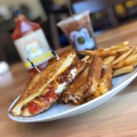 Grilled Cheese Supreme Sandwich · Grilled tomato, bacon, melted goat and cheddar cheese on grilled challah bread.
