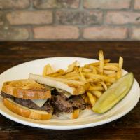 Pot Roast Sandwich · Slow-roasted tender pot roast in natural au jus topped with melty Swiss cheese on sourdough ...