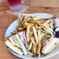 Yacht Club · A triple decker! Toasted sourdough, turkey, ham, bacon, smashed avocado, tomato, cheddar, ro...