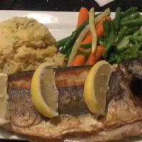 Bronzini  · Grilled whole Mediterranean sea bass not filleted.