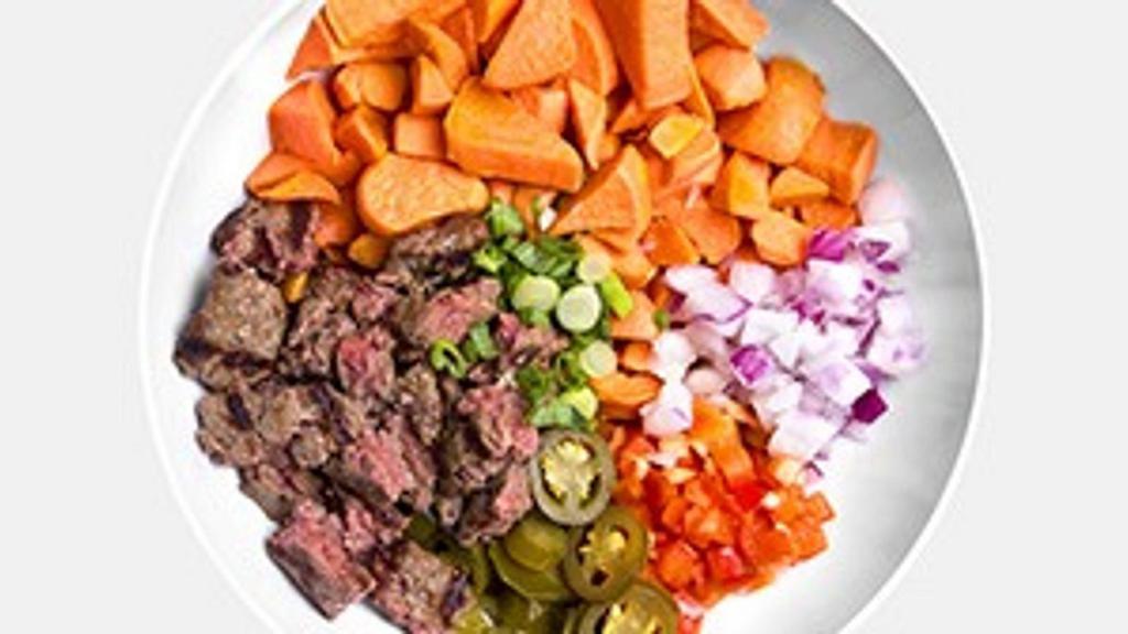 Boss Bowl · 2 organic grass-fed bison patties, grilled sweet potatoes, red onions, green onions, red peppers and jalapenos.