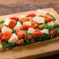 Caprese Pizza (large) · Homemade tomato sauce, fresh mozzarella ovoline, sliced tomato and fresh basil.