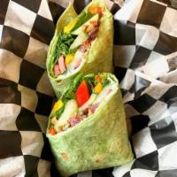 Vonnegut · Herbed cream cheese, spinach, sweet bell pepper, cucumber and tapenade on spinach herb wrap