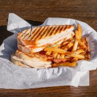 Turkey Basil Panini · Thinly sliced turkey breast pressed with Swiss cheese, tomato and fresh basil.